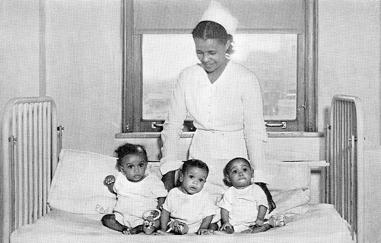 A nurse looks over triplets born in General Hospital No. 2 in 1939. BLACK ARCHIVES OF MID-AMERICA