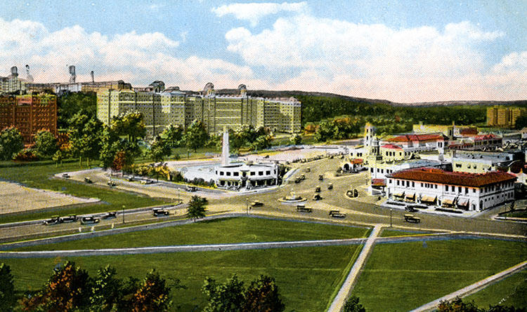 Postcard showing the intersection of 47th Street and Mill Creek Parkway, ca. 1930s. The white building in the center is the Chandler Landscaping and Floral Company. It was replaced by the Giralda Tower.