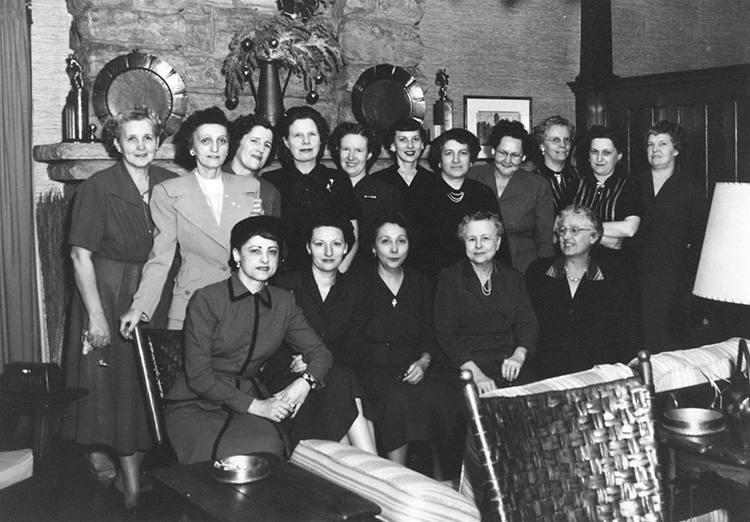 Nell Donnelly Reed (seated, first at left) and employees of the Donnelly Garment Company.