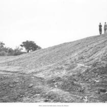 Men Standing near Landfill